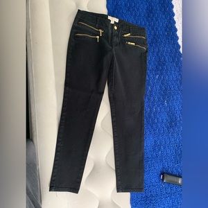 Micheal Kors Black jeans with gold zipper detailing. Size 8 . Tapered at ankle.